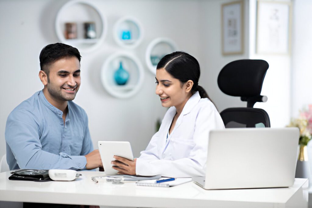 Healthcare provider and patient reviewing recovery plans on tablet in modern medical office with decorative circular wall art