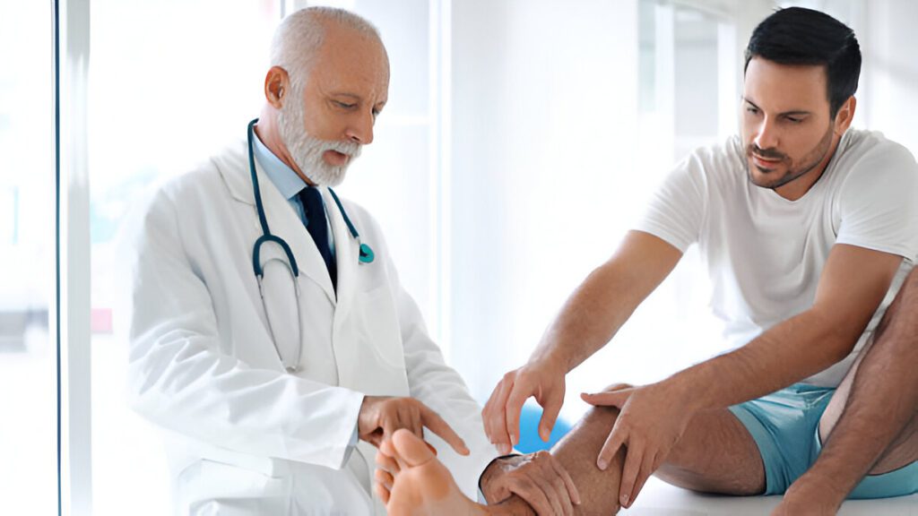 Healthcare provider in white coat with stethoscope discussing ankle joint fusion procedure with patient in clinical setting