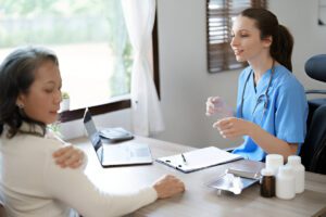 Middle-aged woman consulting with healthcare professional about joint fusion surgery